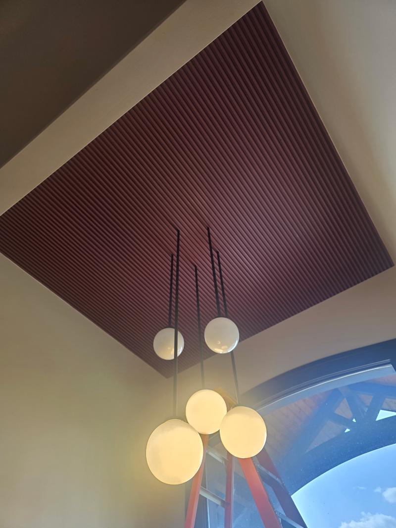 Finished slatted ceiling feature with pendant lighting